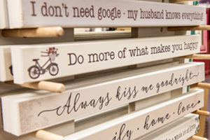 decorative shelf signs with various sayings