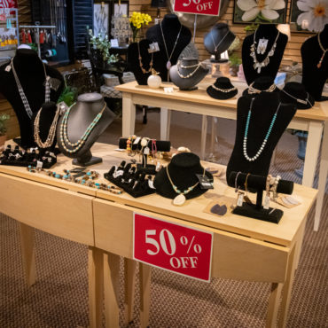 50% off jewelry display - necklaces on small mannequin necks & torsos