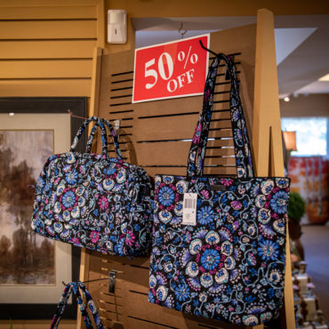 50% off rack holding two floral bags