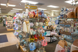 toddler items display which includes teething rings, bibs, stuffed animals, and more